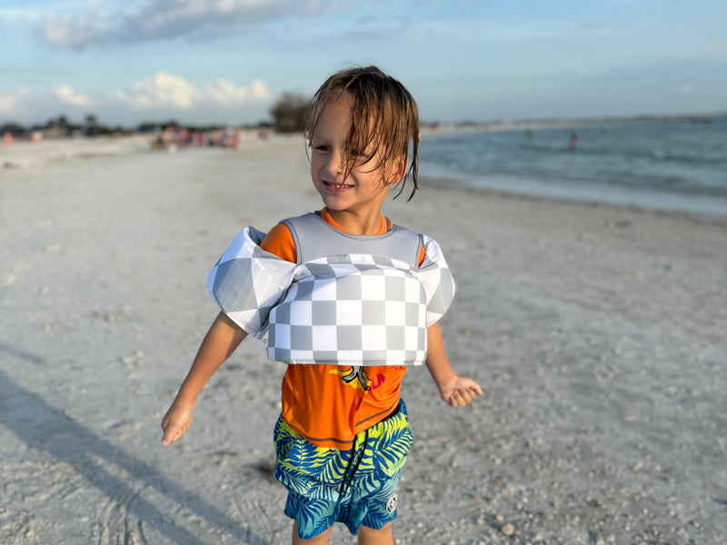 KIDSco Swim Vest for Kids 30-50 lbs. A Puddle Jumper Swimming Float Aid with Shoulder Straps and Arm Water Wings. for Boys and Girls Aged 2-6 Tan Checkerboard