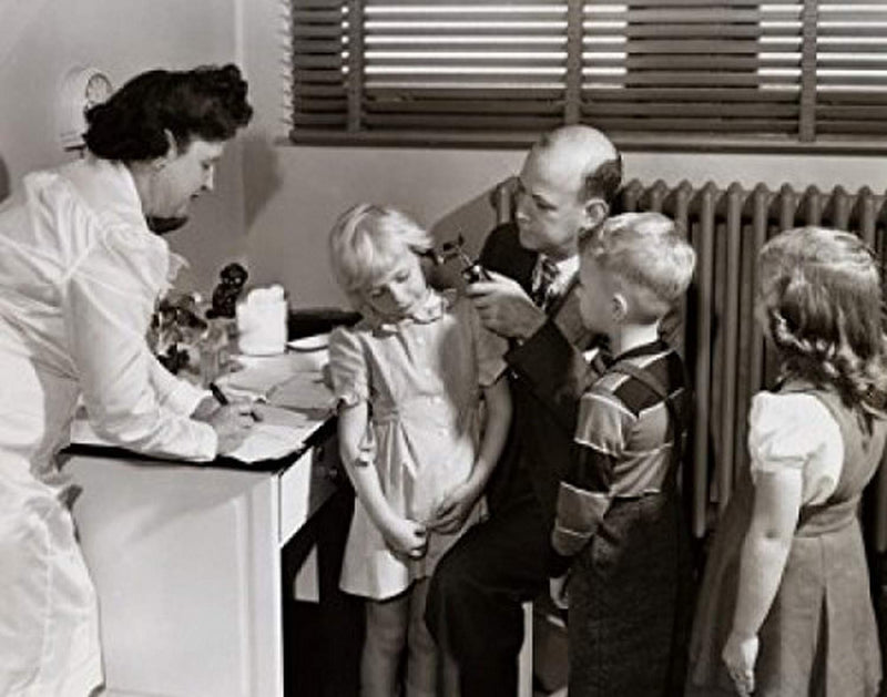 Posterazzi Male doctor examining a girl's ear with an otoscope Poster Print, (18 x 24) - BeesActive Australia