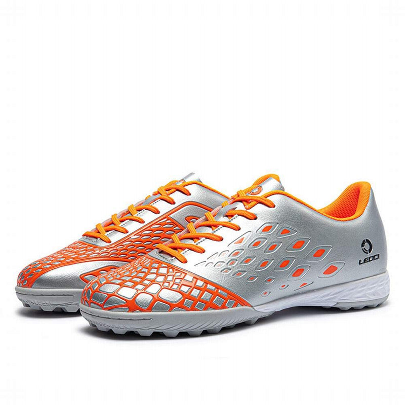 LEOCI Soccer Shoes - Turf Sole Men & Women Kid's Academy Outdoor Football Durable Emboss Rubber Shoes 8.5 Women/7.5 Men Silver/Orange - BeesActive Australia