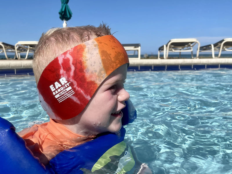 EAR BAND-IT Ultra Tie Dye Swimming Headband – ONLY Swim Ear Band Invented by ENT Doctor – Block Water Secure Earplugs – Kid & Adult Sizes – Recommended Water Protection for Bath, Shower, Pool, Beach Medium (ages 2 to 8yrs) Orange Tie Dye - BeesActive Australia