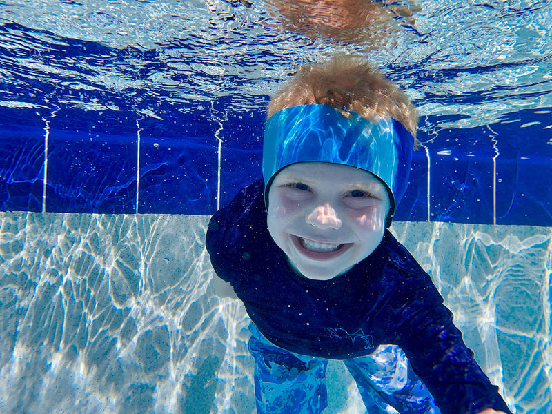 EAR BAND-IT Ultra Tie Dye Swimming Headband – ONLY Swim Ear Band Invented by ENT Doctor – Block Water Secure Earplugs – Kid & Adult Sizes – Recommended Water Protection for Bath, Shower, Pool, Beach Large (ages 9yrs to adult) Blue Tie Dye - BeesActive Australia